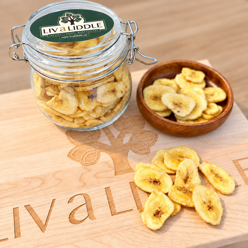 Banana chips photo with the black object in the top right corner removed and the board and table extended in its place